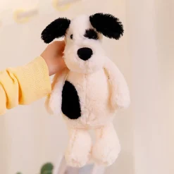 Peluche chien blanc avec un œil noir