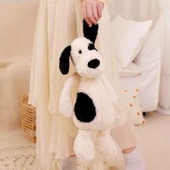 Peluche chien blanc avec un œil noir