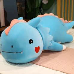 Peluche dinosaure avec un cœur sur la joue