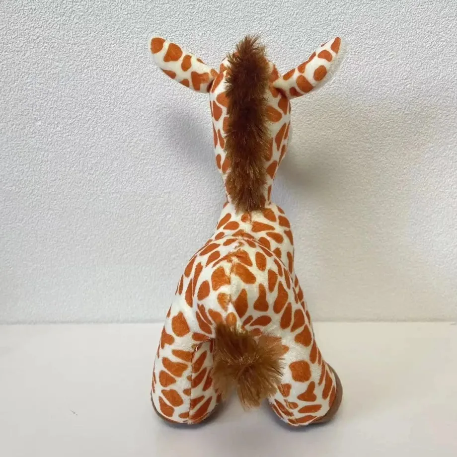 Peluche girafe aux gros yeux