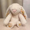 Peluche lapin doux oreilles fleuries printemps enfant