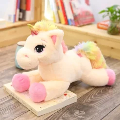 Peluche licorne avec des étoiles dans les yeux