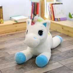 Peluche licorne avec des étoiles dans les yeux