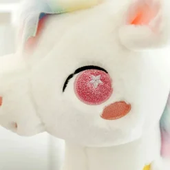 Peluche licorne blanche étoilée avec ailes et corne dorée