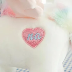 Peluche licorne blanche étoilée avec ailes et corne dorée