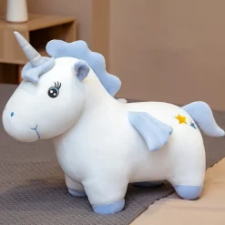 Peluche licorne coloré aux yeux ouverts avec cornet argenté magiques