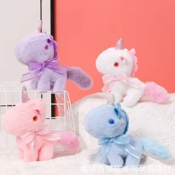 Peluche licorne miniature douce avec nœud et cornet pailleté