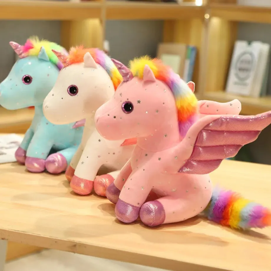 Peluche licorne rose à crinière arc-en-ciel magique