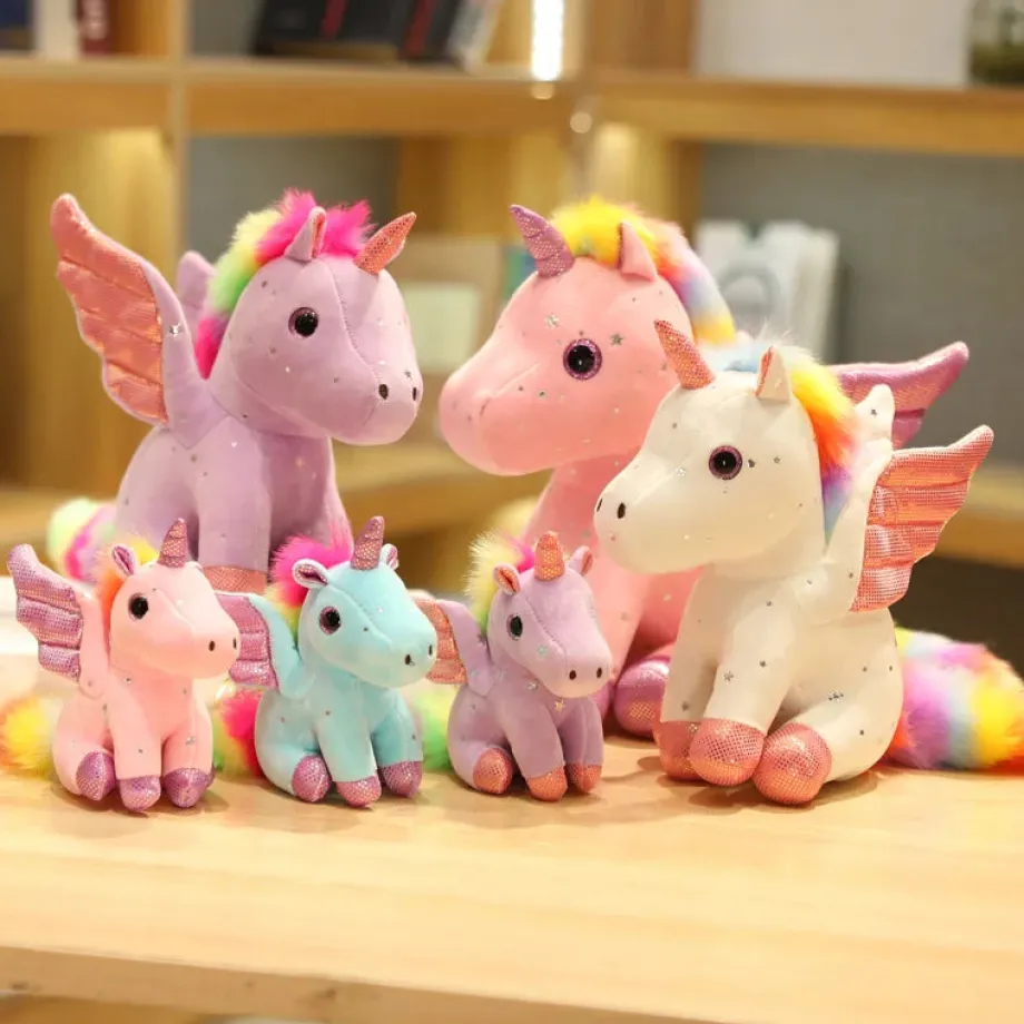 Peluche licorne rose à crinière arc-en-ciel magique