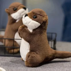 Peluche loutre aux mains jointes