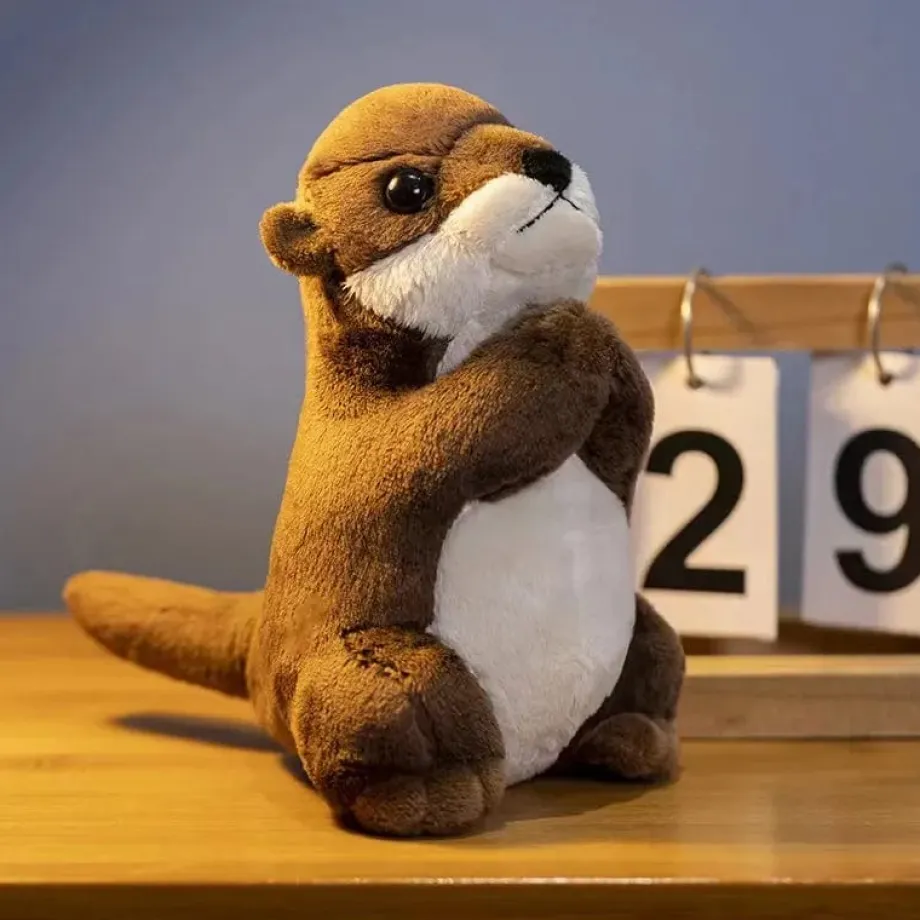 Peluche loutre aux mains jointes