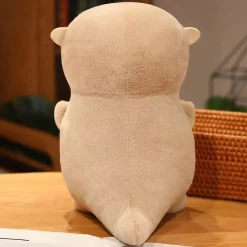 Peluche loutre tenant un poisson