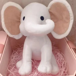 Peluche éléphant coloré avec sa trompe tordue