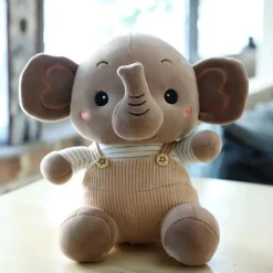 Peluche éléphant content en petite salopette