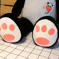 Peluche panda géant avec une fleur