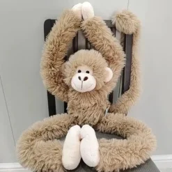 Peluche singe à câlins