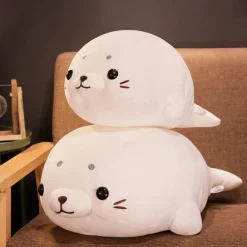 Peluche Squishmallow phoque blanc content