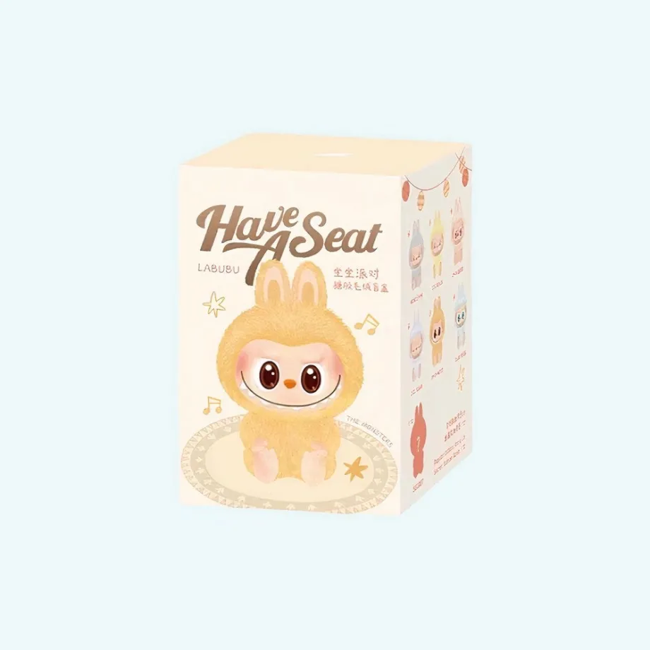 Peluche type Labubu assise boîte mystère