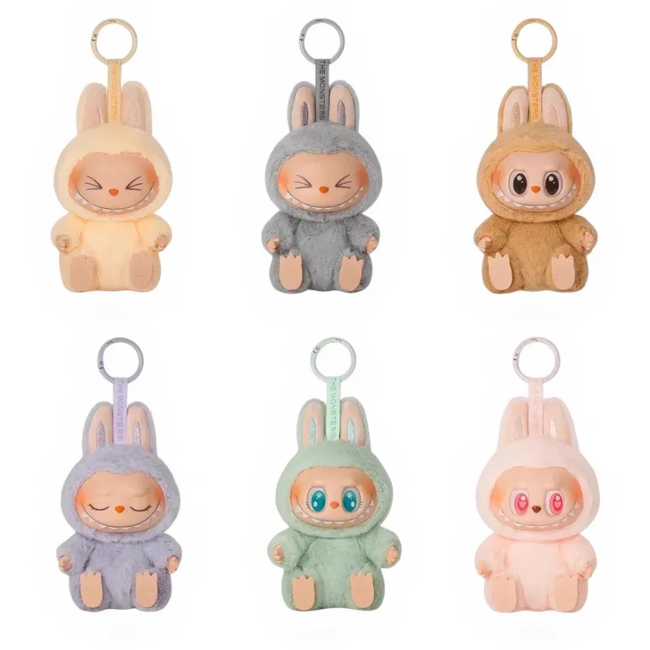 Peluche type Labubu assise boîte mystère