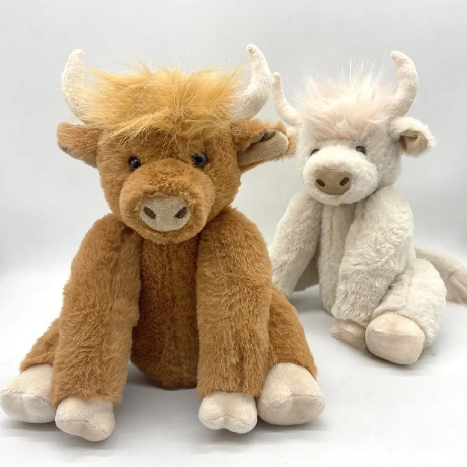 Peluche vache highland marron avec couronne de fleurs
